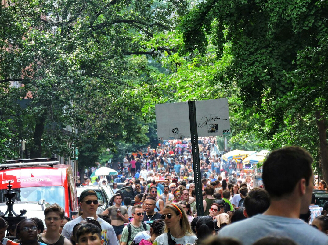 Crowd of people walking on a busy city street